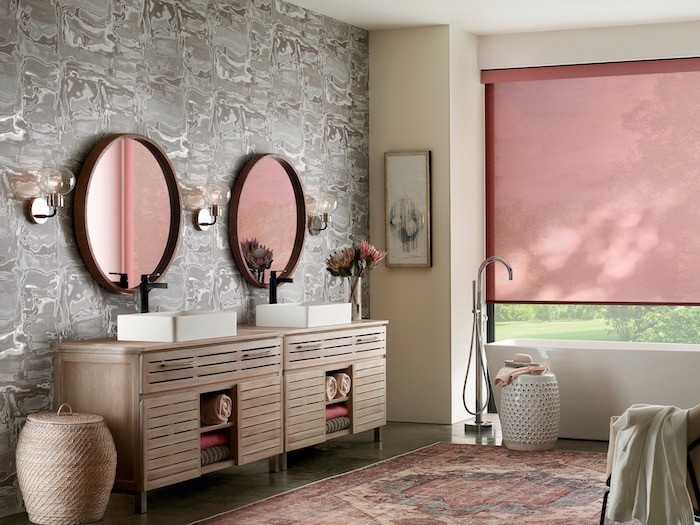A bathroom with vintage wallpaper and modern furniture.